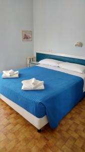 Postel nebo postele na pokoji v ubytování Hotel Biagini