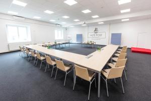 a large conference room with a long table and chairs at Hotel Alte Post Südsteiermark in Leibnitz