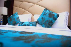 Ένα ή περισσότερα κρεβάτια σε δωμάτιο στο De Rembrandt Hotels and Suites
