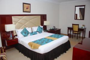 Ένα ή περισσότερα κρεβάτια σε δωμάτιο στο De Rembrandt Hotels and Suites