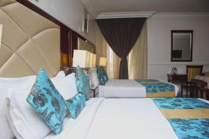 Ένα ή περισσότερα κρεβάτια σε δωμάτιο στο De Rembrandt Hotels and Suites