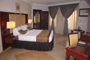Ένα ή περισσότερα κρεβάτια σε δωμάτιο στο De Rembrandt Hotels and Suites