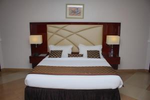 Ένα ή περισσότερα κρεβάτια σε δωμάτιο στο De Rembrandt Hotels and Suites