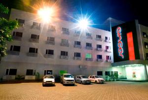 a group of cars parked in a parking lot in front of a building at Ginger Jamshedpur in Jamshedpur