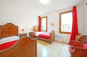 a bedroom with two beds and a couch at DolceVita Apartments N 372 in Venice