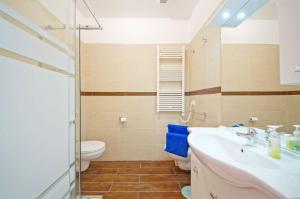 a bathroom with a sink and a toilet at DolceVita Apartments N 372 in Venice