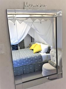 a bedroom with a canopy bed in a glass box at Eden Rest in Cooroy