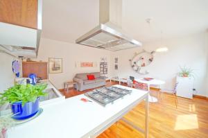 a kitchen and living room with a white counter top at DolceVita Apartments N 329 in Venice