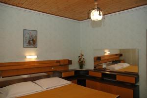Postel nebo postele na pokoji v ubytování Guesthouse Mimas