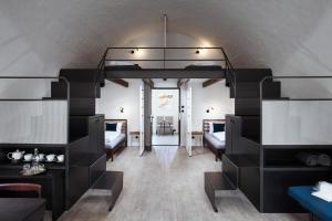 a room with a loft bed and a living room at Long Story Short Hostel & Café in Olomouc +81 photos