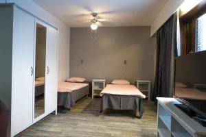 Postel nebo postele na pokoji v ubytování Guesthouse Borealis Apartments