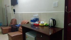 a kitchen with a counter with a coffee maker on it at Nhà Nghỉ Du Lịch Nguyên Vũ in Da Lat