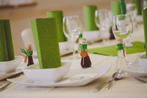 a table with wine glasses and plates on it at Green Resort Glamping in Radlje ob Dravi +37 photos