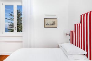 A bed or beds in a room at Hotel Villa Garden