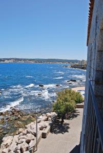 a view of the ocean from the side of a building at Albatros House in L'Escala