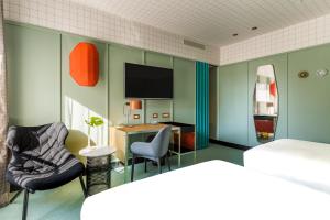 A bed or beds in a room at Room Mate Collection Giulia, Milan