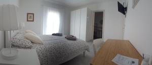 Giường trong phòng chung tại B&B Sogno Salentino