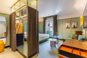 A bed or beds in a room at Room Mate Collection Giulia, Milan