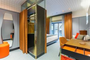 A bed or beds in a room at Room Mate Collection Giulia, Milan