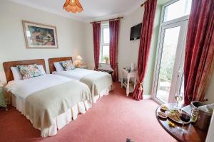 Postel nebo postele na pokoji v ubytování O Donovans Hotel