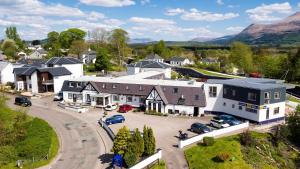 an aerial view of a small town with houses and cars at Moorings Hotel in Fort William