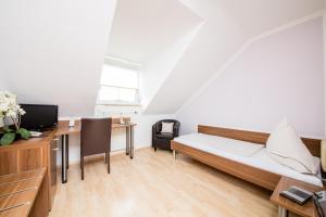 Postel nebo postele na pokoji v ubytování Hotel Bavaria