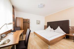 Postel nebo postele na pokoji v ubytování Hotel Bavaria
