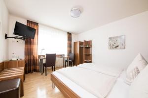 Postel nebo postele na pokoji v ubytování Hotel Bavaria