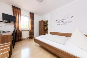 Postel nebo postele na pokoji v ubytování Hotel Bavaria