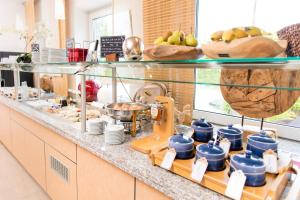 a kitchen with a counter with some food on it at Hotel Bavaria in Dingolfing