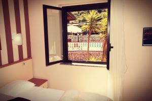 A bed or beds in a room at Fonte Di Bagnaria