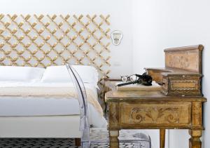 Postel nebo postele na pokoji v ubytování Villa Oriana Relais