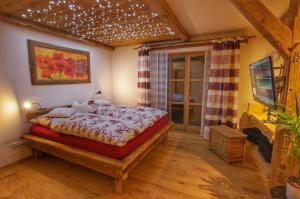 Postel nebo postele na pokoji v ubytování Holzhaus Lugerhof