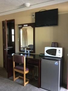 TV in/ali zabaviščno središče v nastanitvi Best Motel