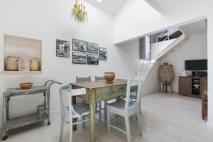 a dining room with a table and chairs at Appartamento Al Bastione by BarbarHouse in Otranto