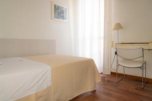 Postel nebo postele na pokoji v ubytování Hotel Nettuno