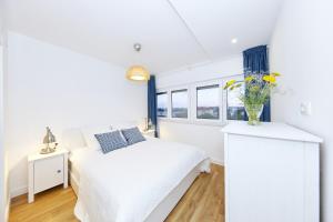 Ένα ή περισσότερα κρεβάτια σε δωμάτιο στο Porat Apartment