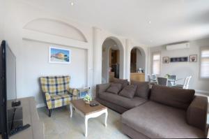 a living room with a couch and a table at Alis's House at Khaoyai in Ban Bung Toei