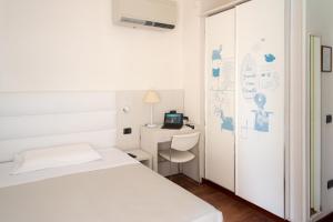 Postel nebo postele na pokoji v ubytování Hotel Nettuno