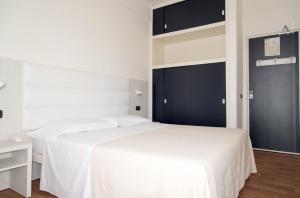 Postel nebo postele na pokoji v ubytování Hotel Nettuno