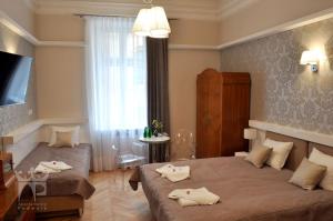 Łóżko lub łóżka w pokoju w obiekcie Apartamenty Podwale