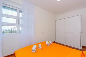 Postel nebo postele na pokoji v ubytování Apartments Bujkovic