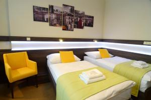 Posteľ alebo postele v izbe v ubytovaní Hotel Uno