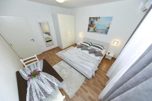 an overhead view of a living room with a couch at Apartments Maruna Self check-in in Zadar