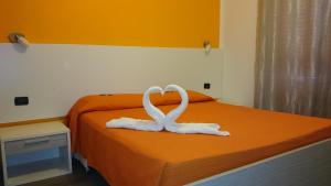 Posteľ alebo postele v izbe v ubytovaní Hotel Ogliastra