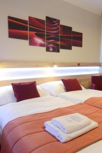 Posteľ alebo postele v izbe v ubytovaní Hotel Uno