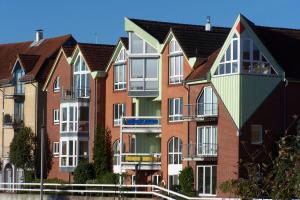 a row of brick houses in a city at Ferienwohnung Marina Cux in Cuxhaven