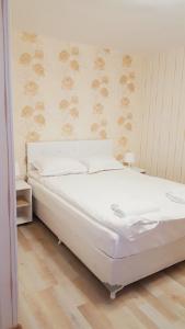 מיטה או מיטות בחדר ב-Villa Rusto