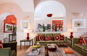 a living room with a couch and a table at Hotel Della Piccola Marina in Capri