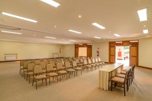 a room with rows of chairs and tables in a room at Hotel Le Renard - Campos do Jordao in Campos do Jordão +98 photos